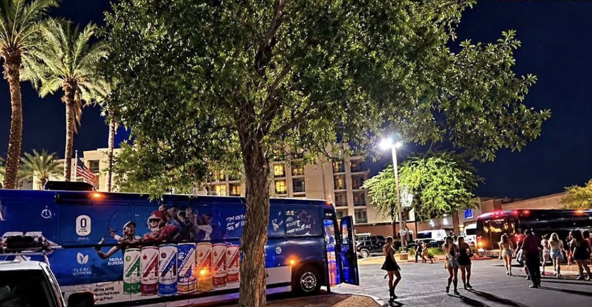 Party bus and crowd at night in Scottsdale